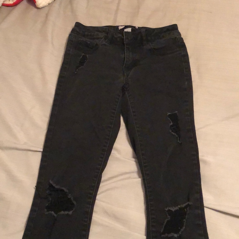 Black distressed low rose skinny jeans
